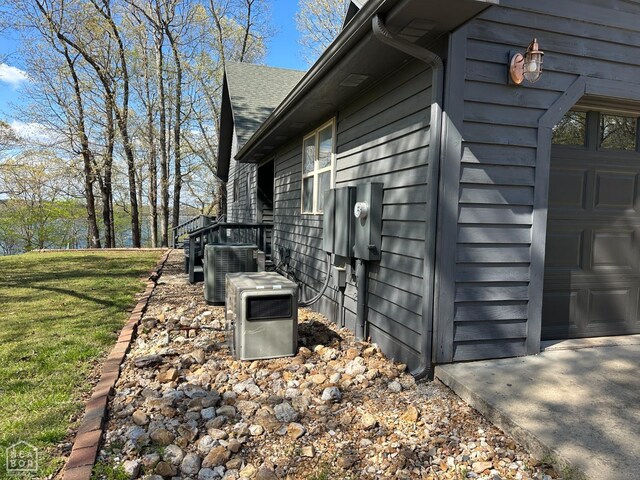 13534 Mc 8001, Yellville, AR 72687 - view of side of property featuring cooling unit and a yard