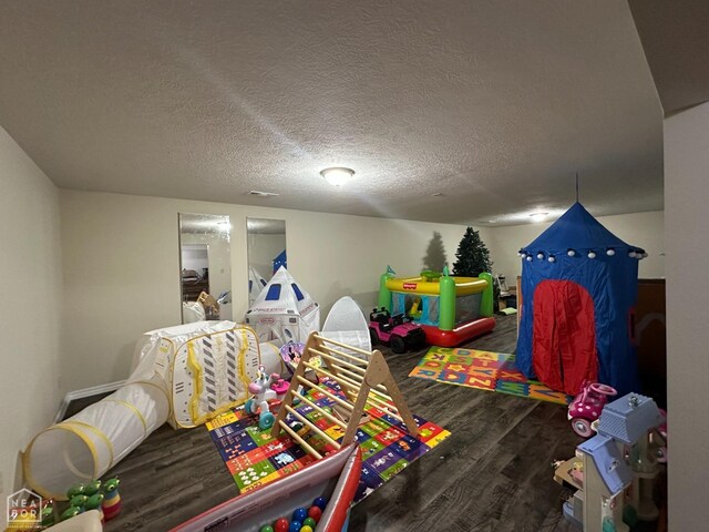 13534 Mc 8001, Yellville, AR 72687 - rec room with wood finished floors and a textured ceiling
