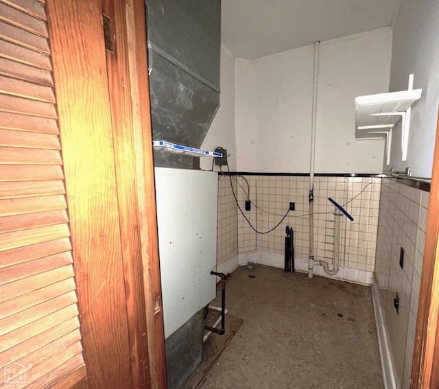 interior space featuring a wainscoted wall