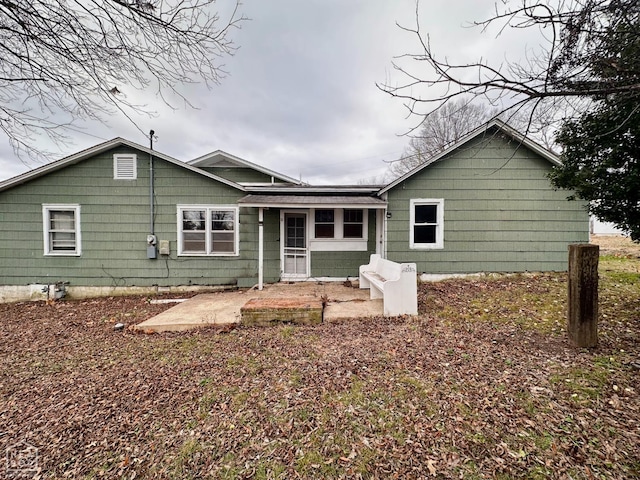 back of property with a patio area