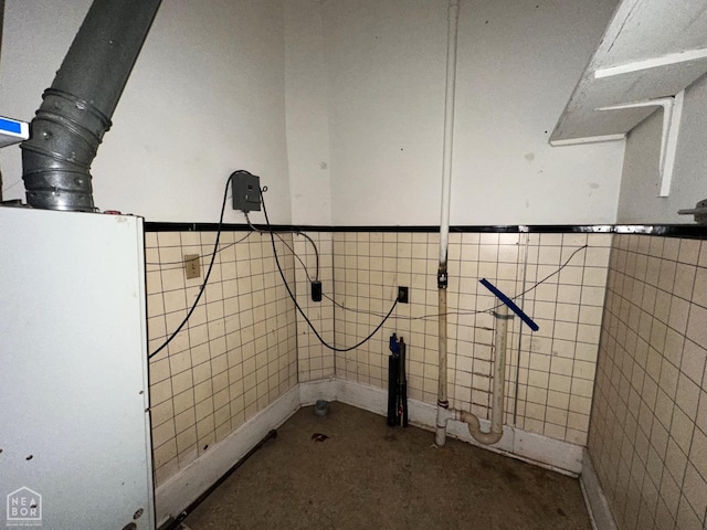 below grade area featuring a wainscoted wall