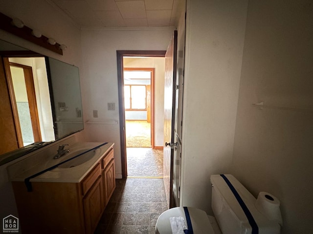 half bathroom featuring toilet and vanity