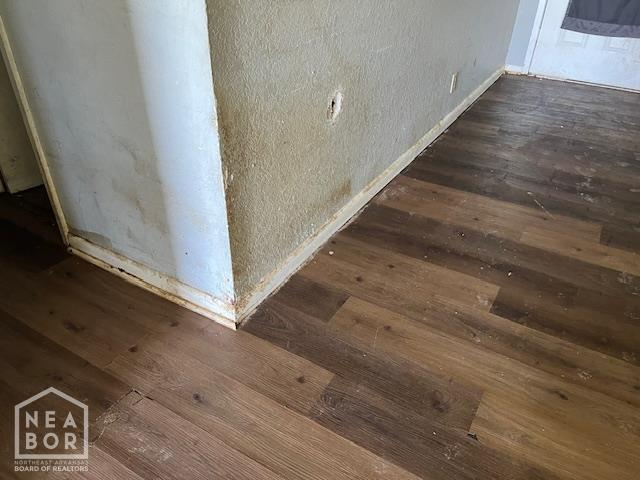 5721 Walcott Rd, Paragould, AR 72450 - detailed view of wood finished floors and baseboards