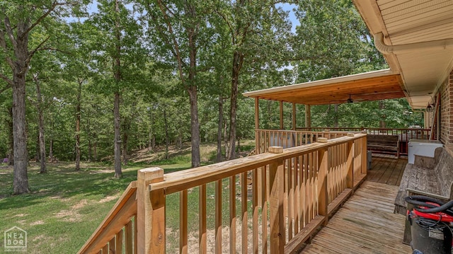 1617 Strawfloor Dr, Jonesboro, AR 72404 - deck featuring a lawn and a ceiling fan