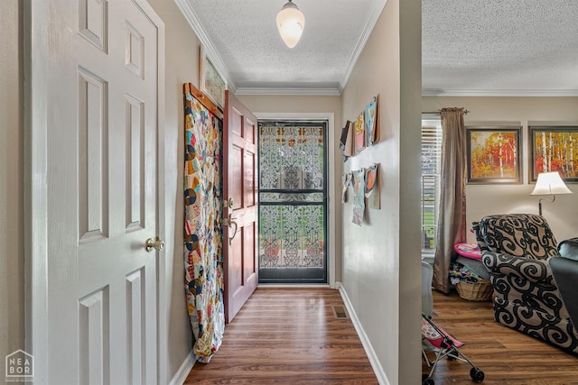 1617 Strawfloor Dr, Jonesboro, AR 72404 - entryway with a textured ceiling, wood finished floors, and ornamental molding