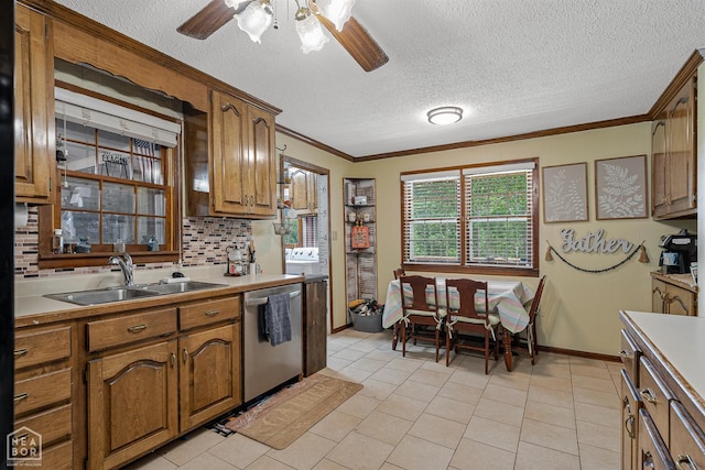 1617 Strawfloor Dr, Jonesboro, AR 72404 - kitchen featuring dishwasher, a ceiling fan, crown molding, a textured ceiling, and brown cabinets