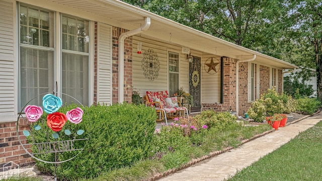 1617 Strawfloor Dr, Jonesboro, AR 72404 - entrance to property with covered porch and brick siding