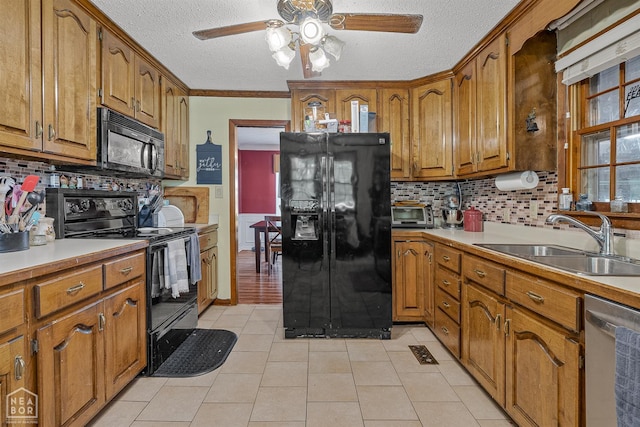 1617 Strawfloor Dr, Jonesboro, AR 72404 - kitchen with black appliances, ceiling fan, brown cabinets, a textured ceiling, and decorative backsplash