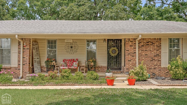 1617 Strawfloor Dr, Jonesboro, AR 72404 - view of front of house featuring brick siding, a porch, and roof with shingles