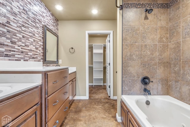 398 Wildwood Pt, Jonesboro, AR 72405 - bathroom with a walk in closet, vanity, recessed lighting, baseboards, and shower / bath combination
