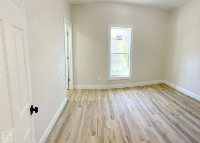 1302 W Monroe Ave, Jonesboro, AR 72401 - empty room with light wood-style floors and baseboards