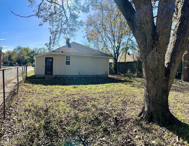 1302 W Monroe Ave, Jonesboro, AR 72401 - back of house featuring a yard and fence