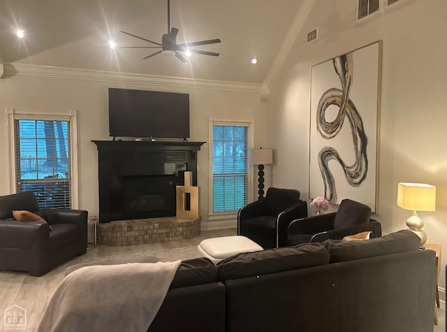 3305 Winged Foot Cv, Jonesboro, AR 72405 - living room featuring a ceiling fan, a glass covered fireplace, ornamental molding, plenty of natural light, and recessed lighting