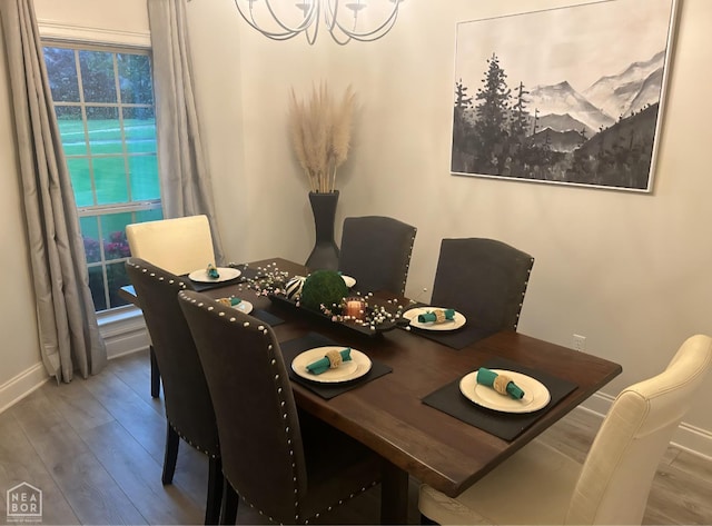 3305 Winged Foot Cv, Jonesboro, AR 72405 - dining room featuring a chandelier and wood finished floors