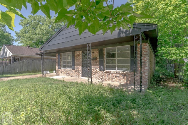 325 S 12th St, West Memphis, AR 72301 - view of side of property featuring brick siding