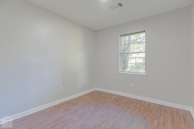 325 S 12th St, West Memphis, AR 72301 - unfurnished room featuring wood finished floors and baseboards