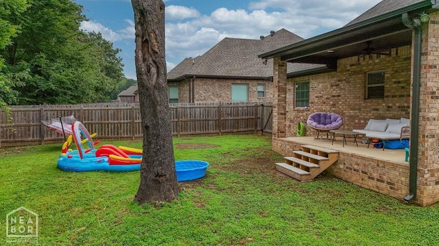 509 Wiregrass Way, Jonesboro, AR 72405 - fenced backyard featuring ceiling fan and a patio area