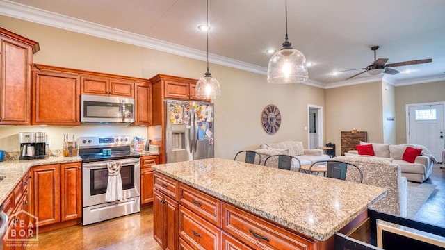 509 Wiregrass Way, Jonesboro, AR 72405 - kitchen with appliances with stainless steel finishes, recessed lighting, a center island, ornamental molding, and open floor plan