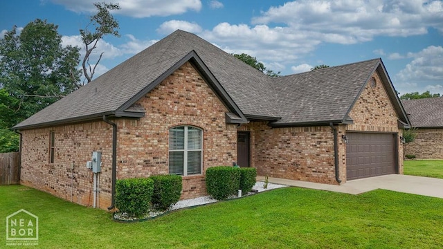 509 Wiregrass Way, Jonesboro, AR 72405 - view of front of home featuring an attached garage, driveway, brick siding, and roof with shingles