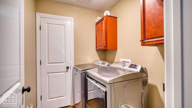 509 Wiregrass Way, Jonesboro, AR 72405 - washroom with cabinet space and independent washer and dryer