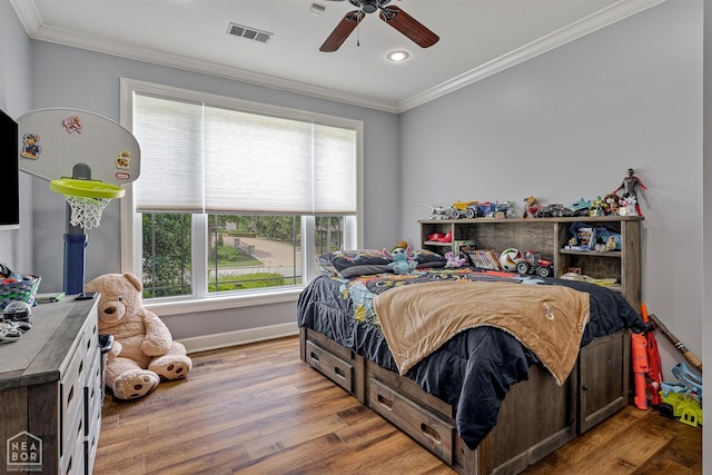 3821 Pebble Beach Dr, Jonesboro, AR 72404 - bedroom featuring crown molding, multiple windows, wood finished floors, recessed lighting, and baseboards