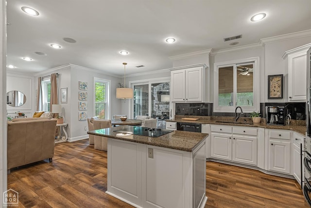 3821 Pebble Beach Dr, Jonesboro, AR 72404 - kitchen with a sink, black appliances, a kitchen island, ornamental molding, and white cabinets