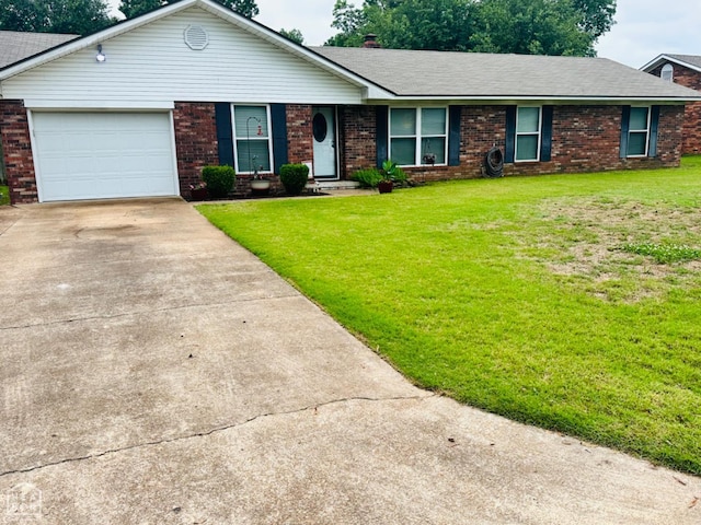 2804 Ivy Dr, Newport, AR 72112 - ranch-style home with concrete driveway, brick siding, an attached garage, and a front yard