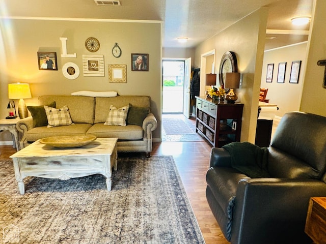 2804 Ivy Dr, Newport, AR 72112 - living room with crown molding and wood finished floors