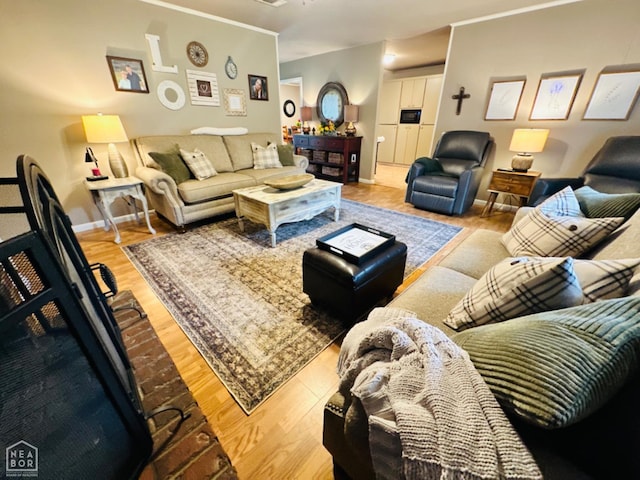 2804 Ivy Dr, Newport, AR 72112 - living area with wood finished floors, baseboards, and crown molding