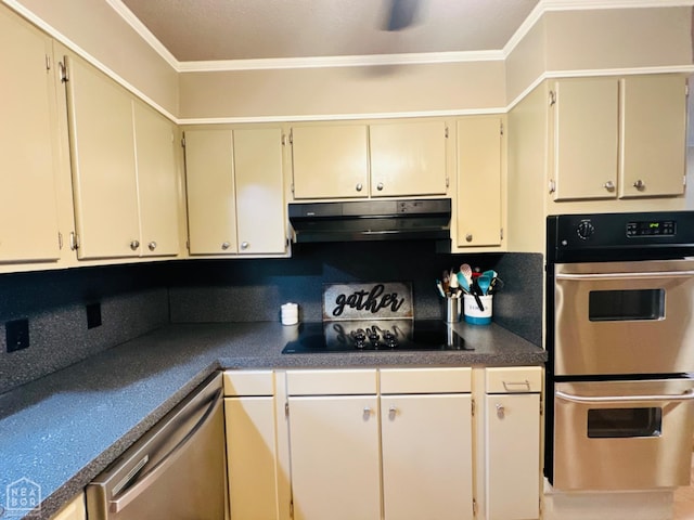 2804 Ivy Dr, Newport, AR 72112 - kitchen with stainless steel appliances, under cabinet range hood, crown molding, dark countertops, and cream cabinets