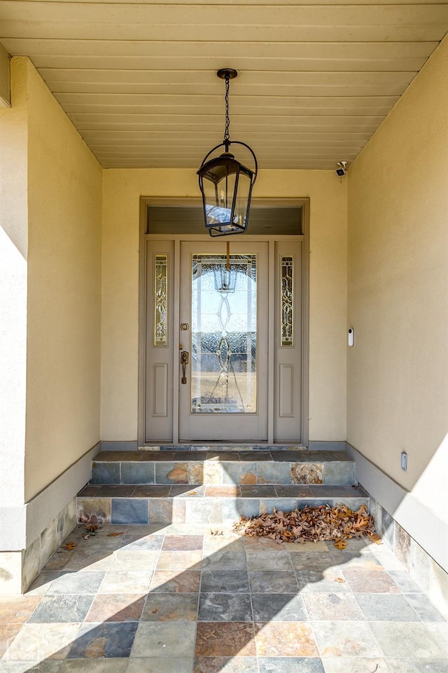 property entrance featuring stucco siding