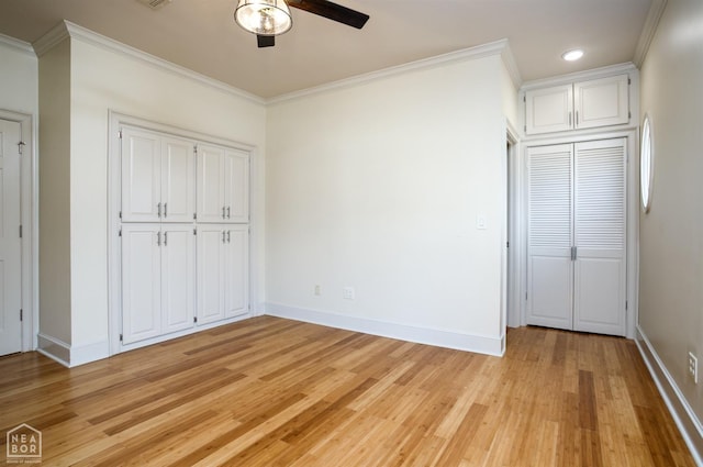unfurnished bedroom with crown molding, light wood finished floors, and baseboards