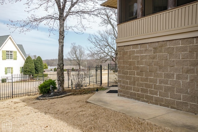 view of yard featuring fence and a gate