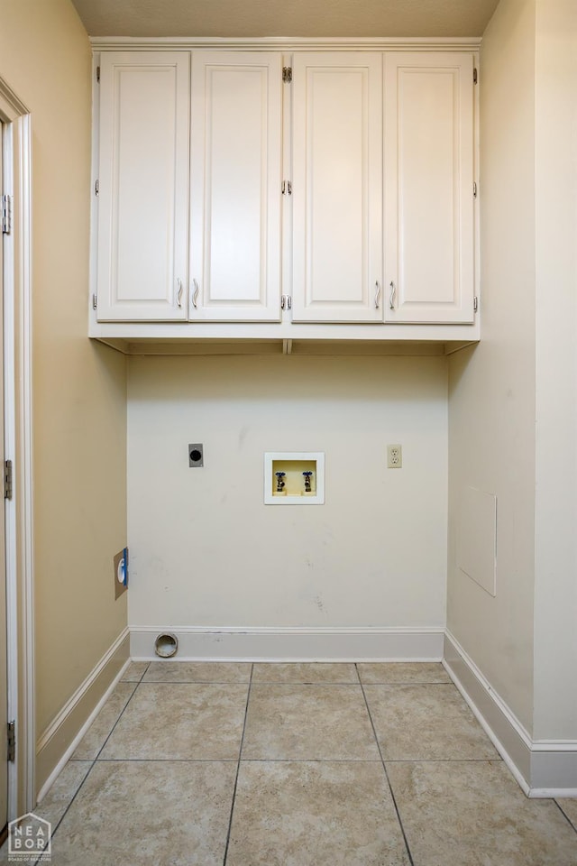 laundry room featuring baseboards, electric dryer hookup, light tile patterned flooring, hookup for a washing machine, and cabinet space