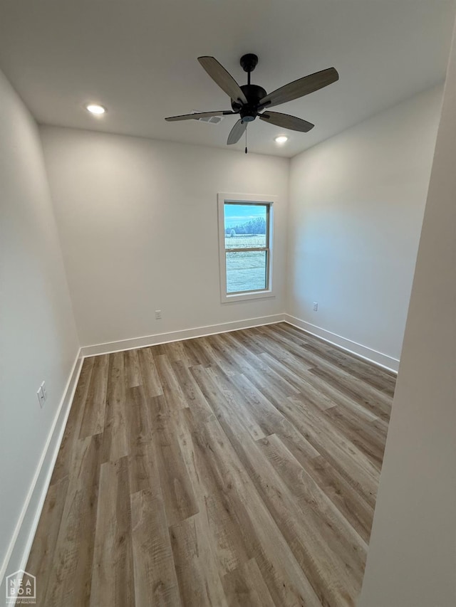unfurnished room featuring recessed lighting, ceiling fan, baseboards, and wood finished floors