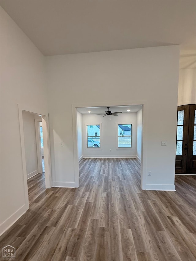 interior space with baseboards and wood finished floors