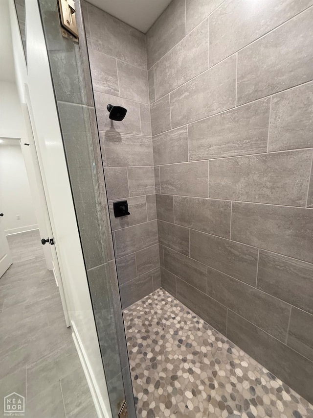 full bathroom with a tile shower