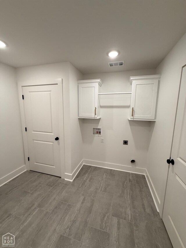 laundry area featuring hookup for an electric dryer, baseboards, hookup for a washing machine, and visible vents