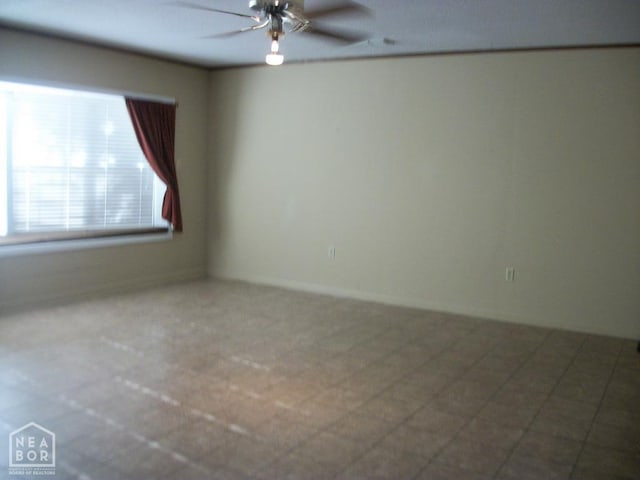 unfurnished room with a ceiling fan
