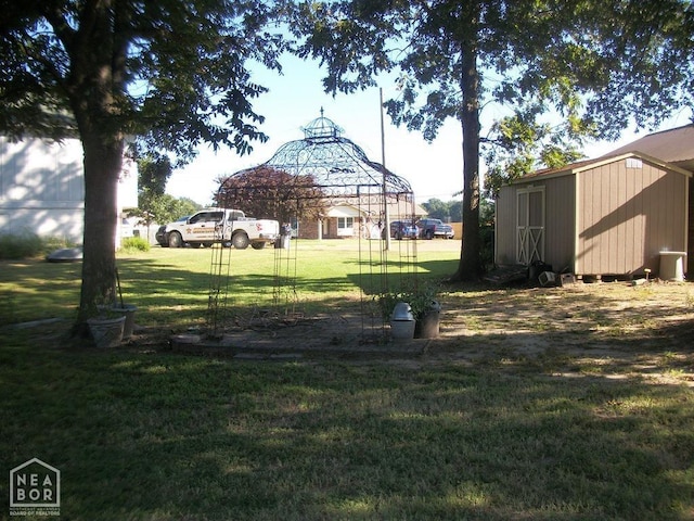 view of yard with a shed and an outdoor structure