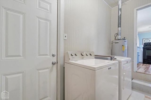 208 S Rockingchair Rd, Paragould, AR 72450 - washroom with electric water heater and washer and dryer