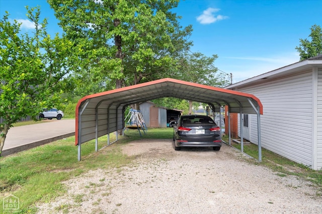 208 S Rockingchair Rd, Paragould, AR 72450 - view of vehicle parking featuring a detached carport and driveway