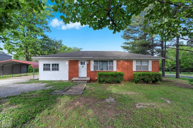208 S Rockingchair Rd, Paragould, AR 72450 - view of front of property with a front lawn, a carport, driveway, and brick siding