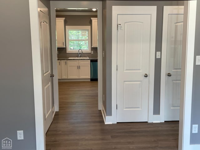 3502 Burdyshaw Dr Drive, Jonesboro, AR 72405 - corridor featuring dark wood-style flooring, baseboards, and a sink