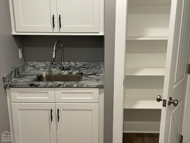 3502 Burdyshaw Dr Drive, Jonesboro, AR 72405 - bar featuring a sink and wood finished floors