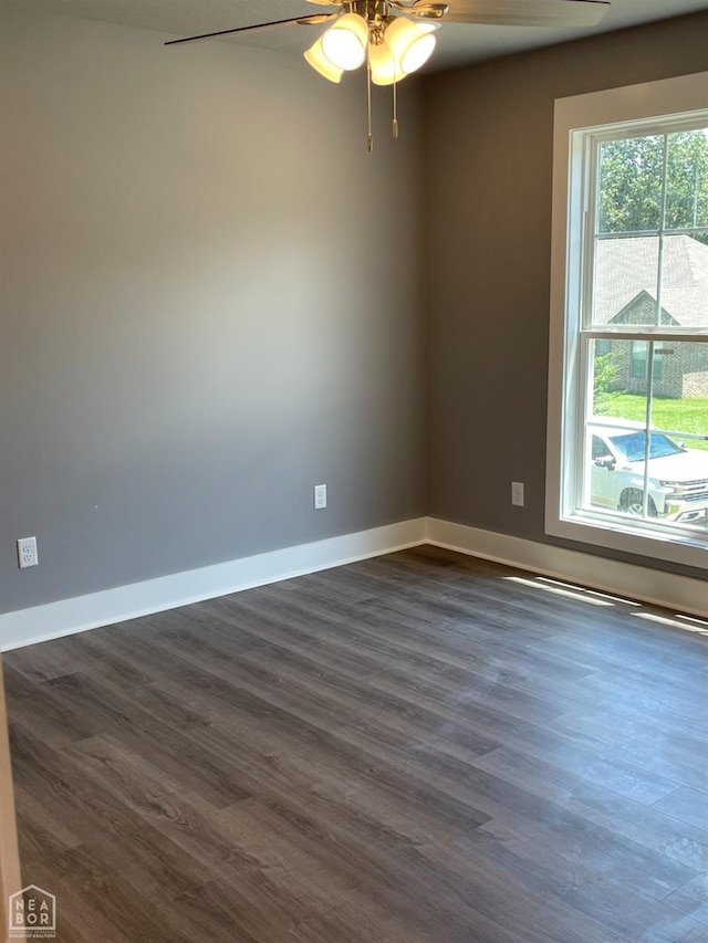 3502 Burdyshaw Dr Drive, Jonesboro, AR 72405 - spare room with dark wood-style flooring, ceiling fan, and baseboards