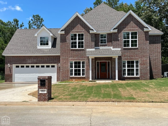 3502 Burdyshaw Dr Drive, Jonesboro, AR 72405 - view of front of home with brick siding, a front yard, and concrete driveway