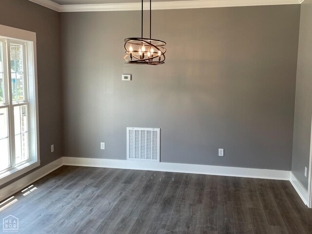 3502 Burdyshaw Dr Drive, Jonesboro, AR 72405 - spare room with plenty of natural light, dark wood-type flooring, visible vents, and ornamental molding