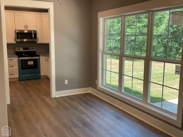 3502 Burdyshaw Dr Drive, Jonesboro, AR 72405 - kitchen featuring dark wood finished floors, white cabinets, baseboards, and stainless steel appliances