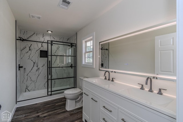 full bathroom with visible vents, toilet, and a sink